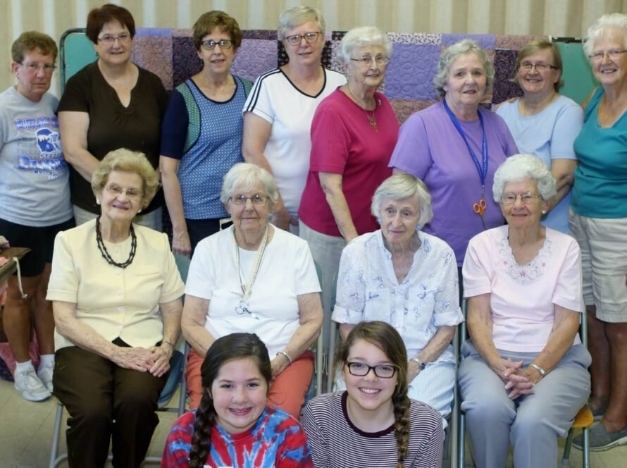Quilt group of several ladies posing
