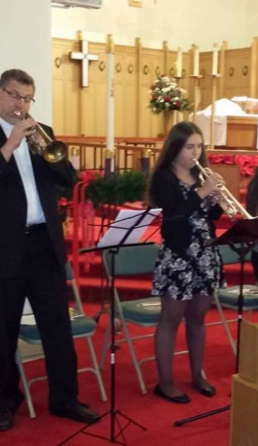 People playing instruments in church